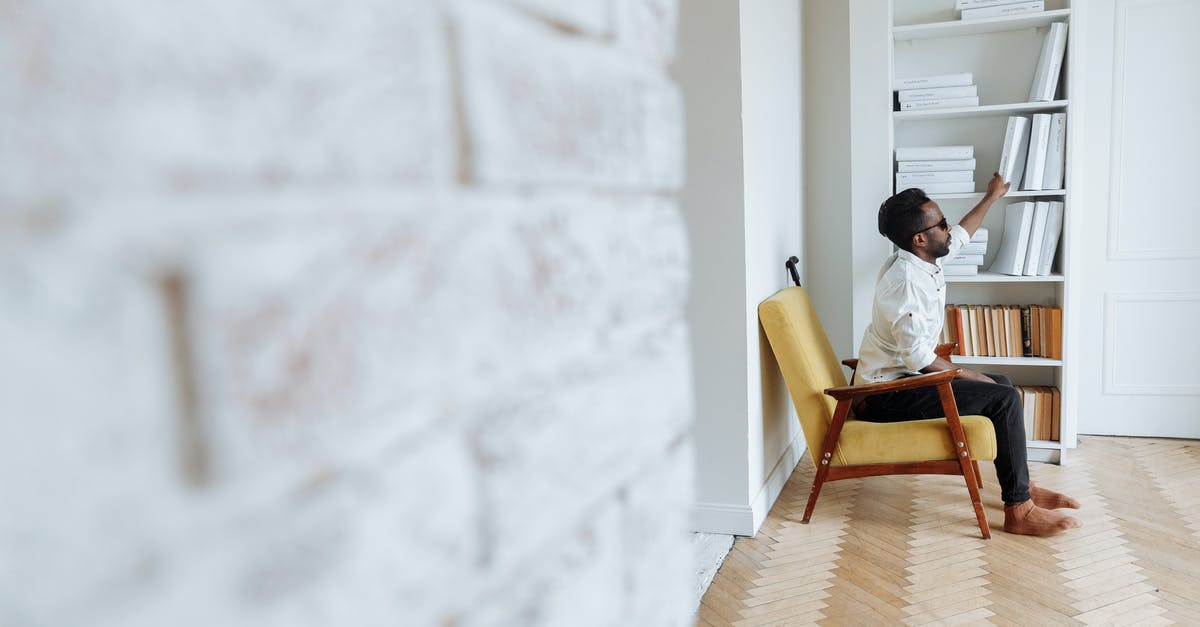 Getting well domed muffins [duplicate] - Man in White Dress Shirt Sitting on Brown Wooden Chair