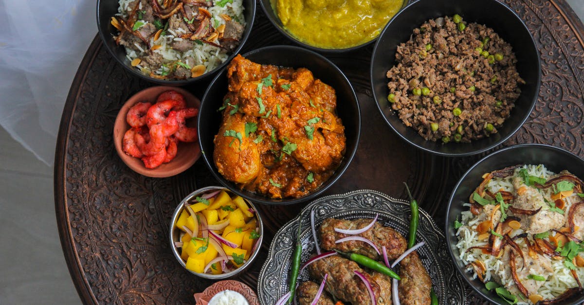 Ghee vs. butter in Indian curries - Cooked Food on Black Ceramic Bowl Ghee vs. butter in Indian curries - Cooked Food on Black Ceramic Bowl
