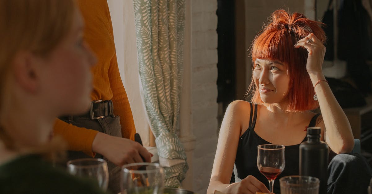 Ginger drink question - Woman in Black Tank Top Sitting Beside Woman in White Tank Top Ginger drink question - Woman in Black Tank Top Sitting Beside Woman in White Tank Top