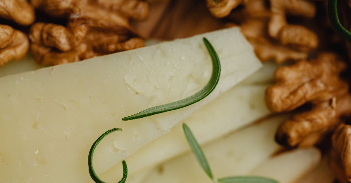 Ginger vs Ginger Root - Green Veggies on White Surface Ginger vs Ginger Root - Green Veggies on White Surface