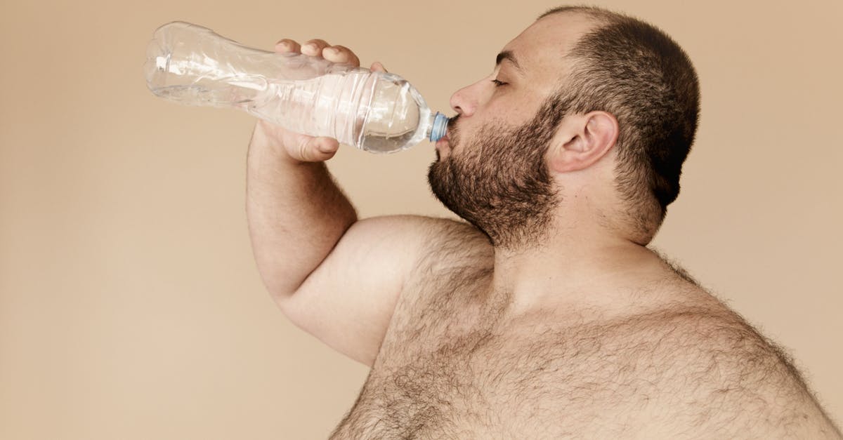 Given that fat has a lower specific heat than water, why do meats with higher fat content take longer to cook? - Man Drinking from Clear Plastic Bottle