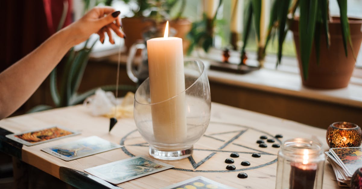 Glass bowl safe in pressure cooker? - Crop unrecognizable female fortune teller with amulet near tarot cards and shiny candles during prediction process at home Glass bowl safe in pressure cooker? - Crop unrecognizable female fortune teller with amulet near tarot cards and shiny candles during prediction process at home