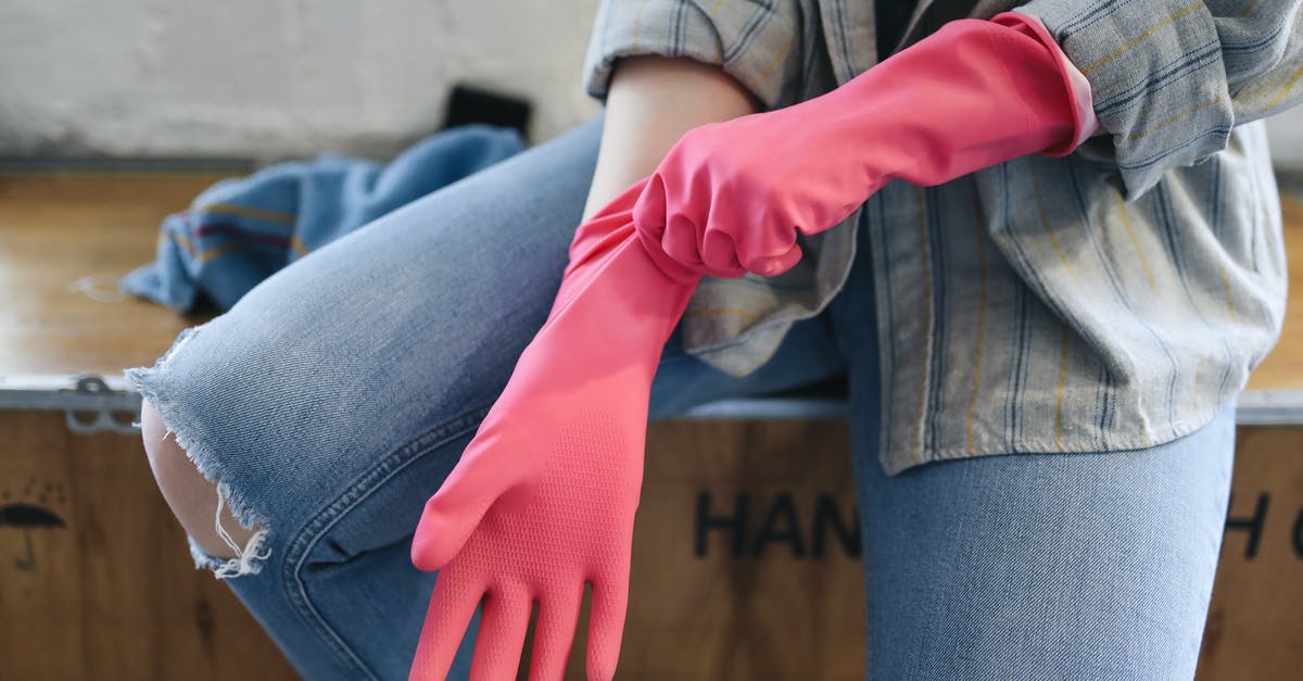 Gloves for newbies pulling sugar? - A Person Sitting on a Wooden Box Putting on Rubber Gloves Gloves for newbies pulling sugar? - A Person Sitting on a Wooden Box Putting on Rubber Gloves