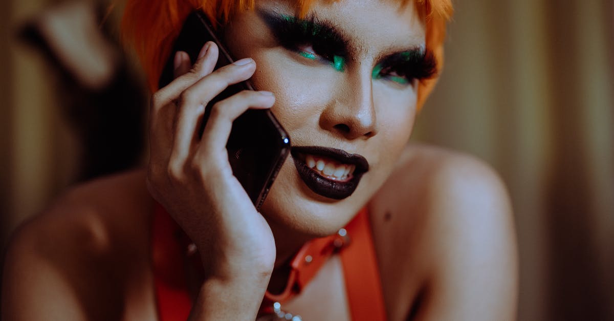 Gluten free bread in breadmaker looks weird and doesn't rise - Crop young informal ethnic lady with bright makeup and short orange hair smiling while lying on stomach and talking on smartphone Gluten free bread in breadmaker looks weird and doesn't rise - Crop young informal ethnic lady with bright makeup and short orange hair smiling while lying on stomach and talking on smartphone