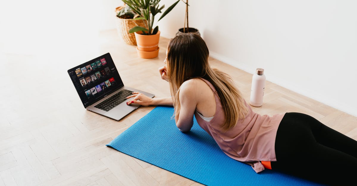 Gluten Free Challah not keeping shape - Young woman lying on floor on mat while using laptop at home Gluten Free Challah not keeping shape - Young woman lying on floor on mat while using laptop at home