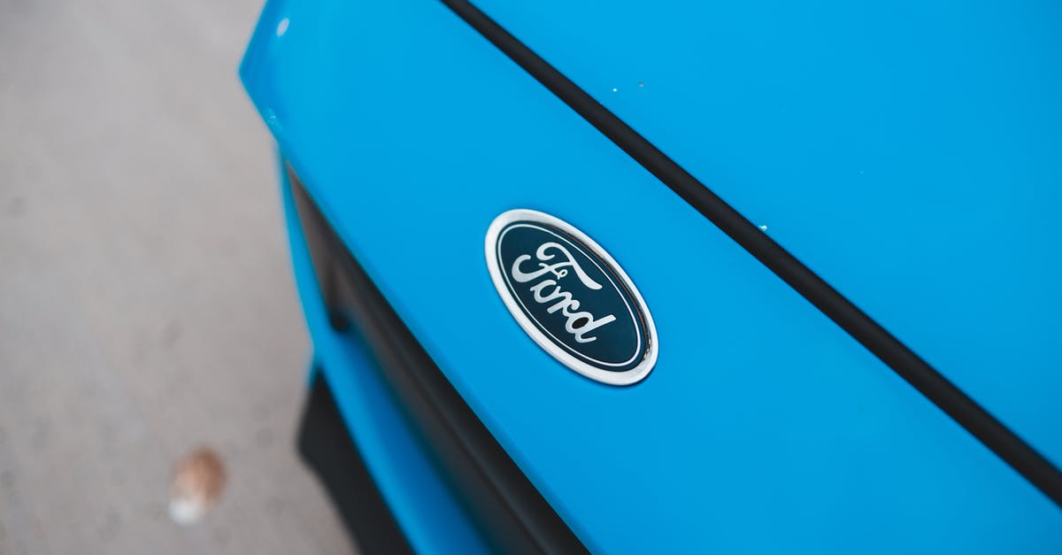 Gluten tester; simple and fast - Nameplate of modern blue car Gluten tester; simple and fast - Nameplate of modern blue car