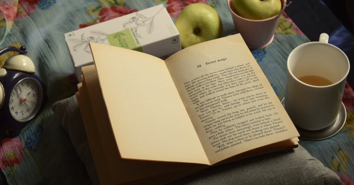 Good book on the chemistry of cooking? - High angle composition of interesting book placed on soft pillow near cup of aromatic tea and green apples and alarm clock Good book on the chemistry of cooking? - High angle composition of interesting book placed on soft pillow near cup of aromatic tea and green apples and alarm clock