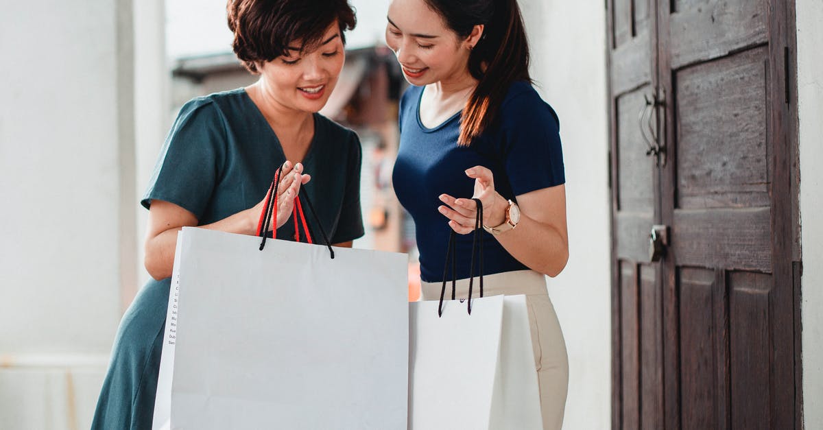 Good Idea to Buy Discount Meat For Freezing? - Happy ethnic women holding paper bags after shopping and showing purchases to each other Good Idea to Buy Discount Meat For Freezing? - Happy ethnic women holding paper bags after shopping and showing purchases to each other