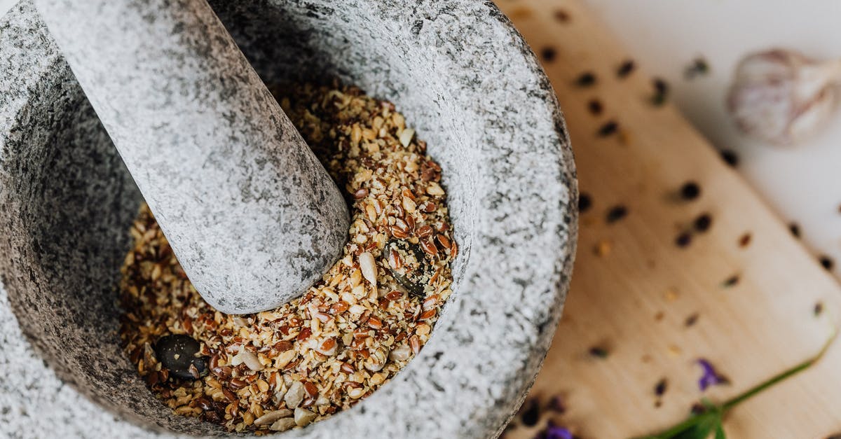 Grinding toasted spices without cooling - Close-Up Photo of a Mortar and Pestle 