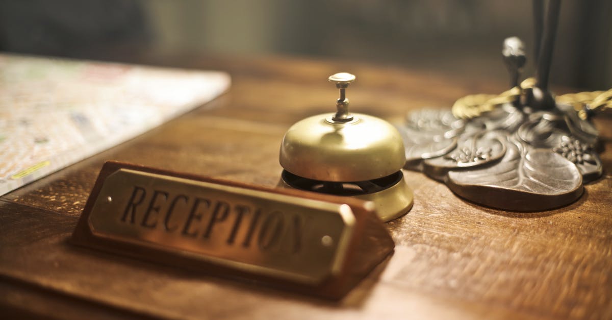Groceries left out on the counter - Old fashioned golden service bell and reception sign placed on wooden counter of hotel with retro interior Groceries left out on the counter - Old fashioned golden service bell and reception sign placed on wooden counter of hotel with retro interior