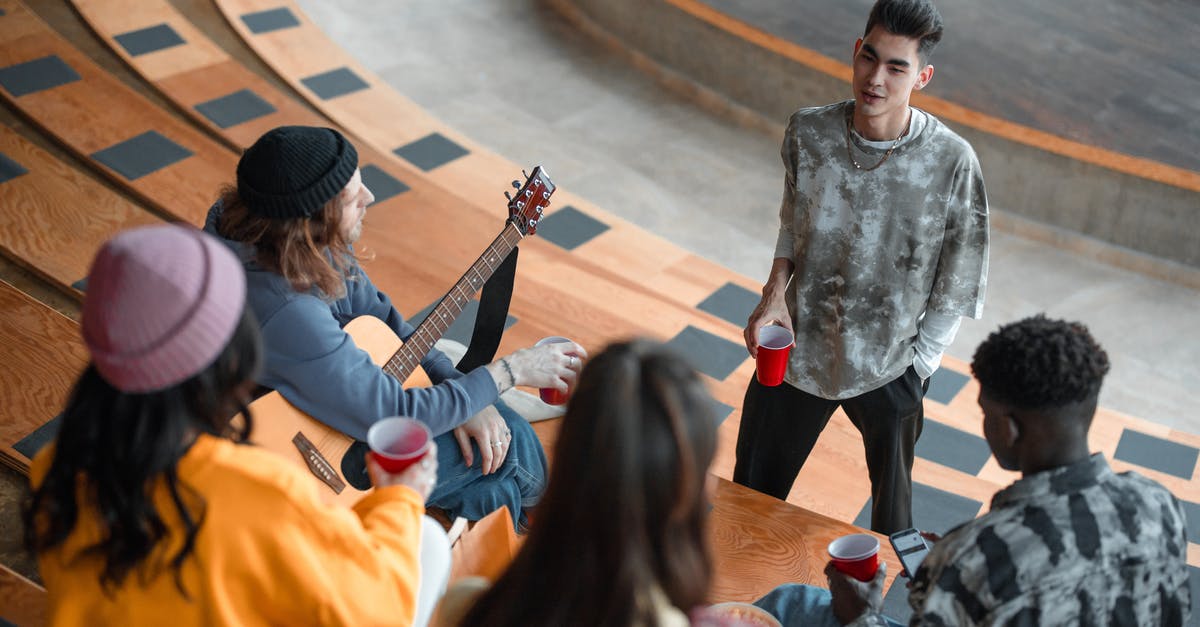 Guacamole Sitting out? - Boy in Gray Sweater Playing Guitar Guacamole Sitting out? - Boy in Gray Sweater Playing Guitar