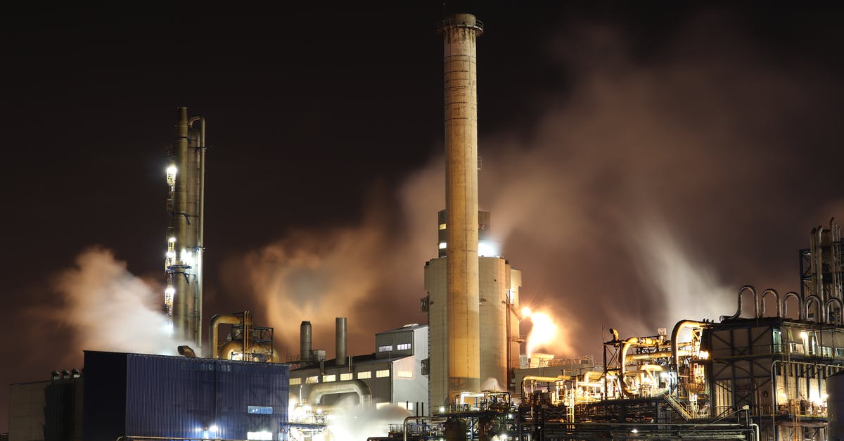 Has the oil started to smoke here? - Brown and White Factory Building during Night Time Has the oil started to smoke here? - Brown and White Factory Building during Night Time