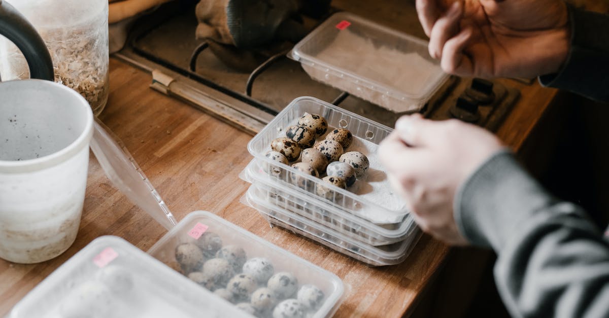 Has the storage duration of packaged "fresh" dairy products increased in the last 30 yrs? - High angle of crop anonymous man packing quail eggs into storage containers at poultry farm Has the storage duration of packaged "fresh" dairy products increased in the last 30 yrs? - High angle of crop anonymous man packing quail eggs into storage containers at poultry farm