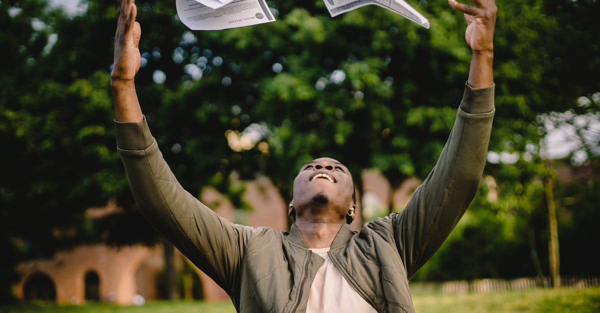 Having trouble getting gluten free bread to rise - Happy African American remote worker tossing papers in air happy to get rid of boring paperwork while sitting in green park