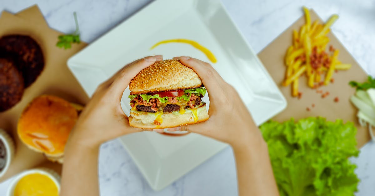 Having trouble with the sweet & sour sauce recipe - Faceless person preparing hamburger in bright cafe Having trouble with the sweet & sour sauce recipe - Faceless person preparing hamburger in bright cafe