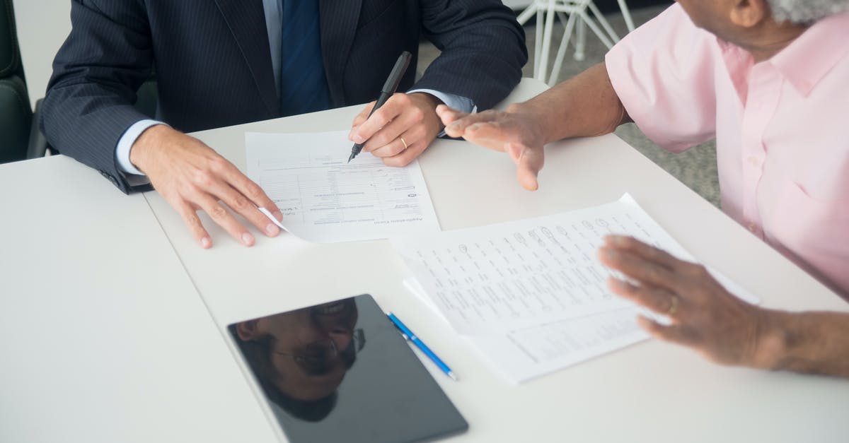 heat-induced leavening agent - Man in Black Suit Jacket Holding Pen Writing on White Paper