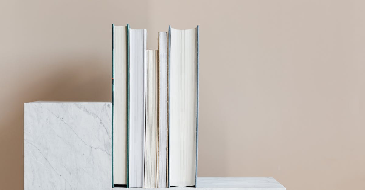 Help finding information on Marble coated woks - Geometric modern marble shelf with set of various books against beige background Help finding information on Marble coated woks - Geometric modern marble shelf with set of various books against beige background
