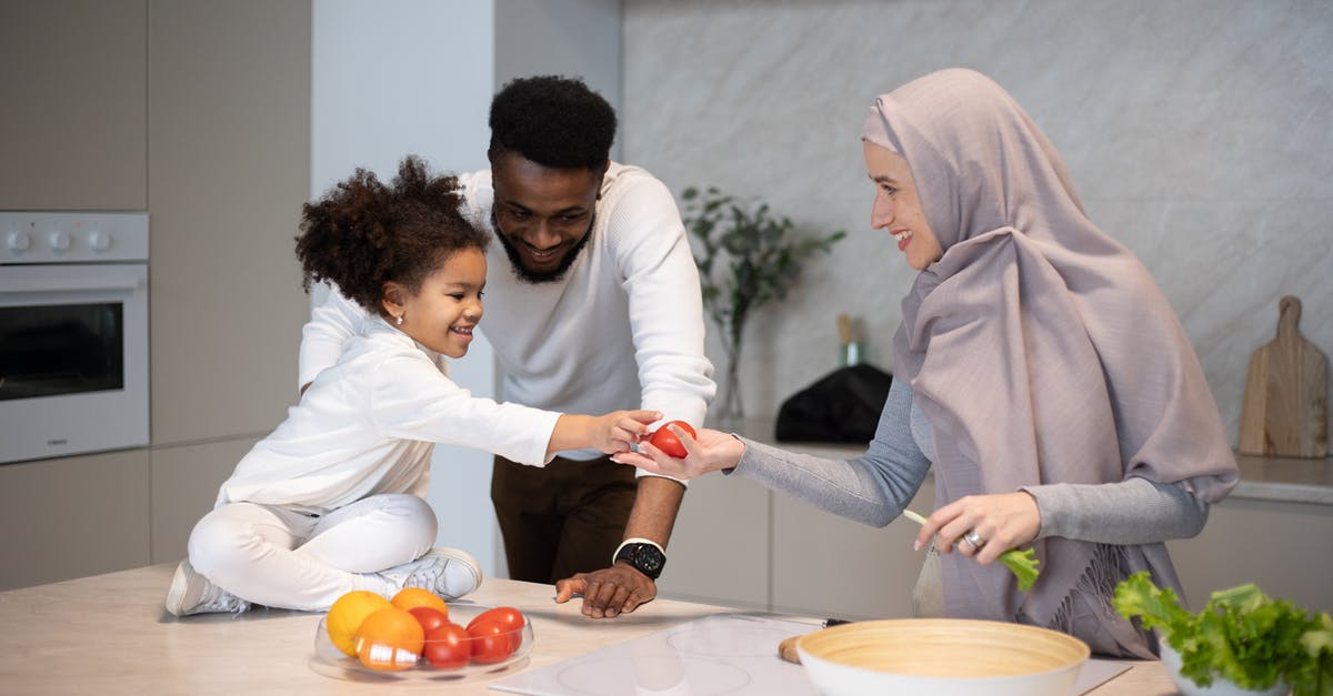 Help Identifying a pale green, spherical squash-y like vegetable - Cheerful multiethnic family cooking together at home Help Identifying a pale green, spherical squash-y like vegetable - Cheerful multiethnic family cooking together at home