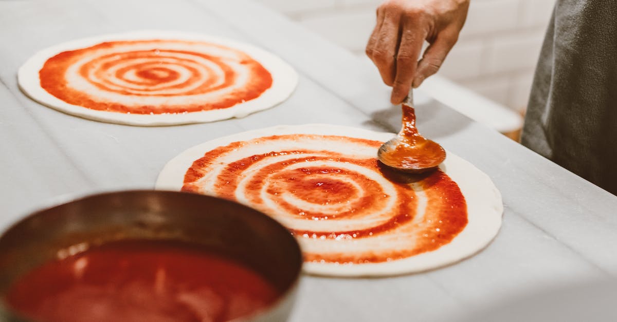 Help with hand tossed pizza dough (like domino's) - Person Putting Pizza Sauce on the Dough Help with hand tossed pizza dough (like domino's) - Person Putting Pizza Sauce on the Dough