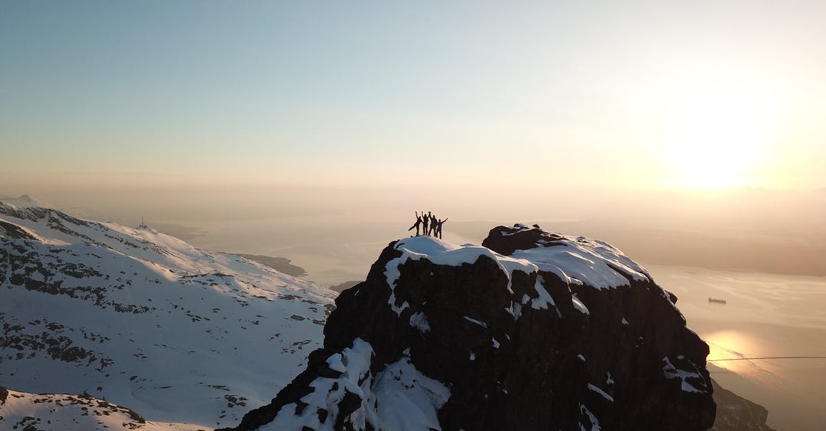 High Elevation Souffle - Four People Above Snow-covered Mountain Top High Elevation Souffle - Four People Above Snow-covered Mountain Top