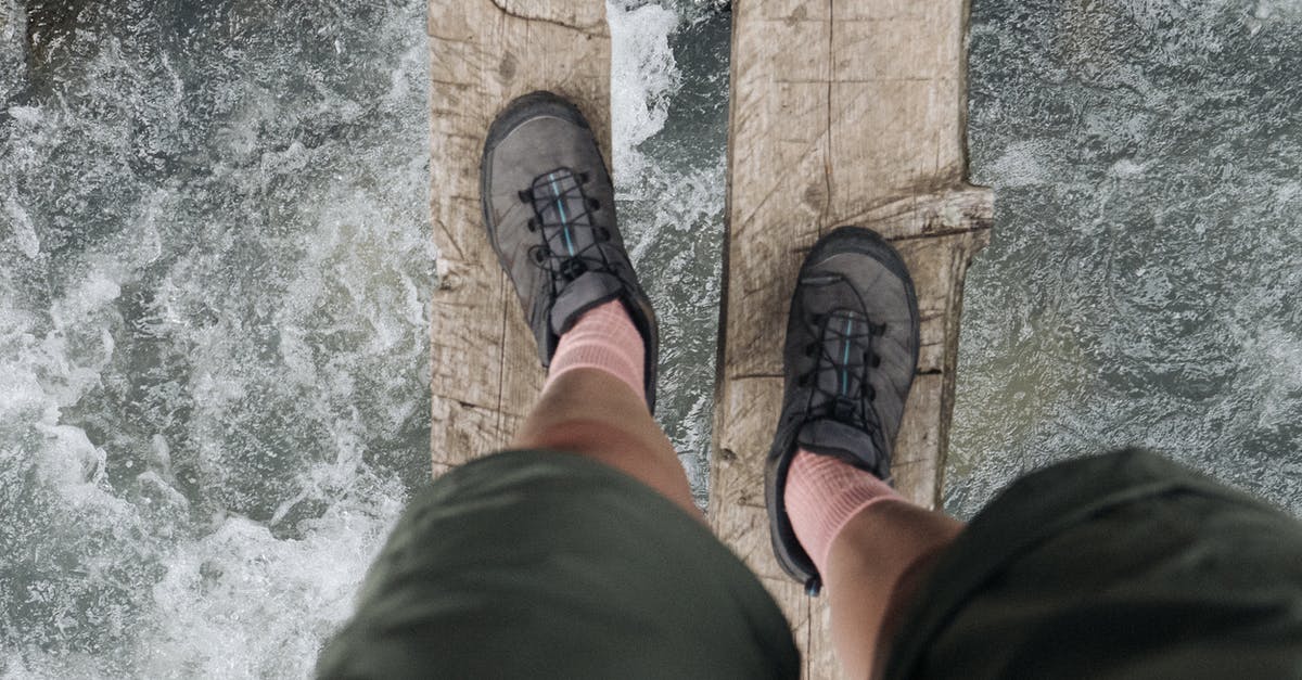 High viscosity fermantation - Person in Black Pants and Brown Hiking Shoes High viscosity fermantation - Person in Black Pants and Brown Hiking Shoes