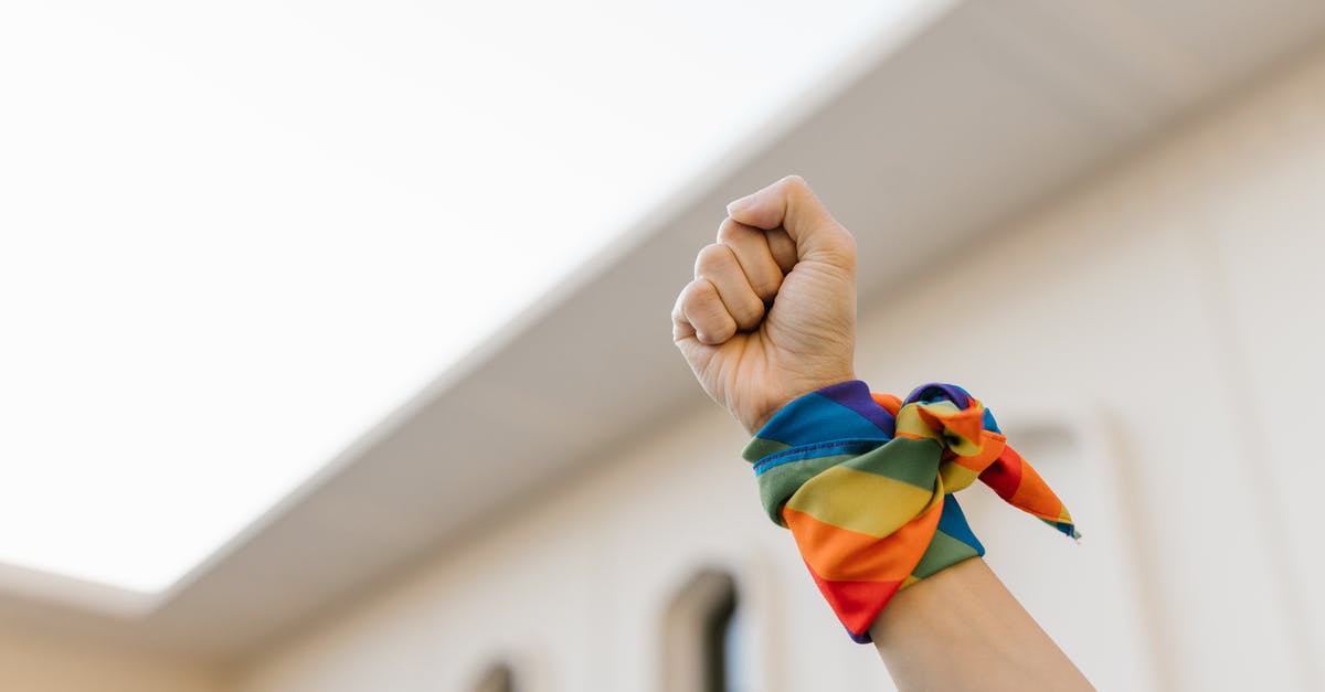 hints for low-carb wraps - Unrecognizable Raised Fist and Wrist Wrapped in Rainbow Cloth hints for low-carb wraps - Unrecognizable Raised Fist and Wrist Wrapped in Rainbow ClothÂ