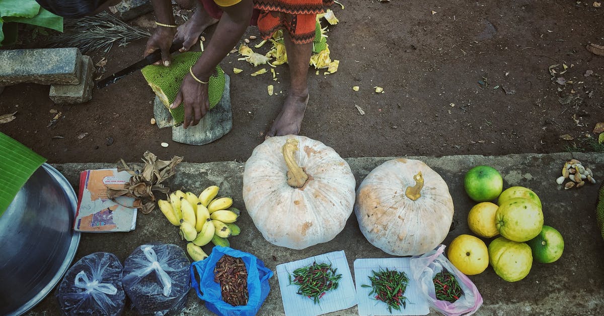 Hints on storage of vegetables and fruit - Woman with Stacked Fruit and Vegetables Hints on storage of vegetables and fruit - Woman with Stacked Fruit and Vegetables