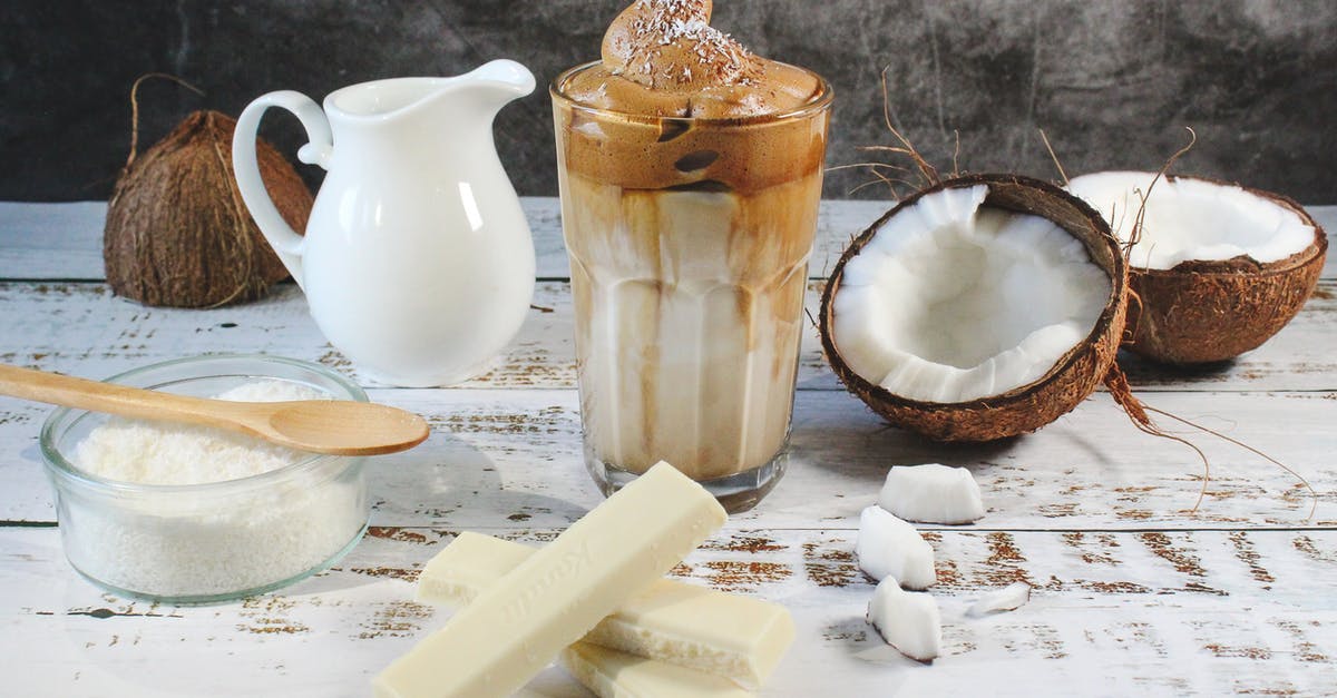 Homemade coconut milk in coffee compared to store bought - White Ceramic Pitcher Beside Clear Glass Bowl on Brown Wooden Table