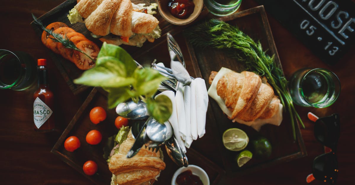 Homemade yeast extract from vegetable stock for nutritional properties - Set of appetizing croissant sandwiches on table in cafe