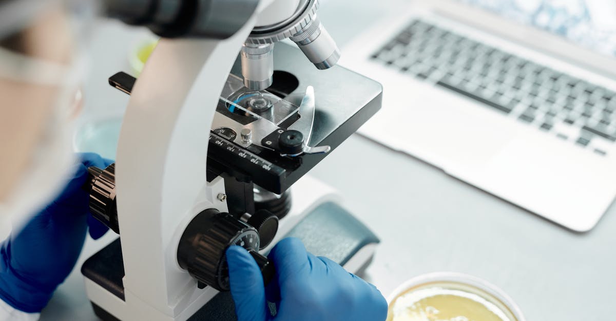 Home-school science curriculum using cooking [closed] - Close-Up Shot of a Scientist Using a Microscope