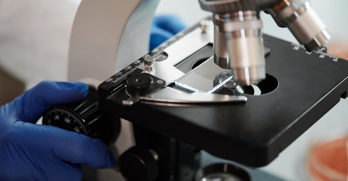 Home-school science curriculum using cooking [closed] - Close-Up Shot of a Scientist Using a Microscope