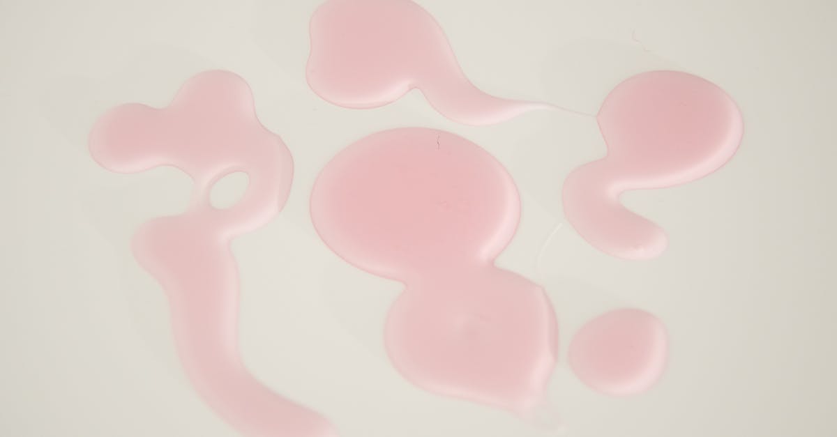 Hot pink spots on surface of ham steak - Textured background of gel drips on white surface Hot pink spots on surface of ham steak - Textured background of gel drips on white surface