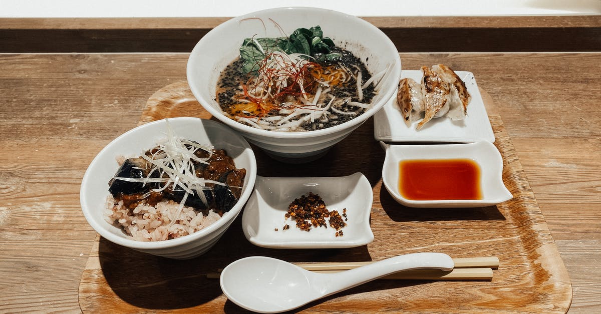 Hot sauce; Remove seeds? - Delicious traditional Asian soup and rice with vegetables served on tray Hot sauce; Remove seeds? - Delicious traditional Asian soup and rice with vegetables served on tray