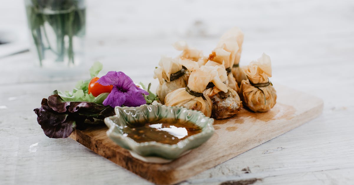 How are strained tomatoes different than tomato sauce? [duplicate] - Dim sum and vegetables on wooden board in cafe