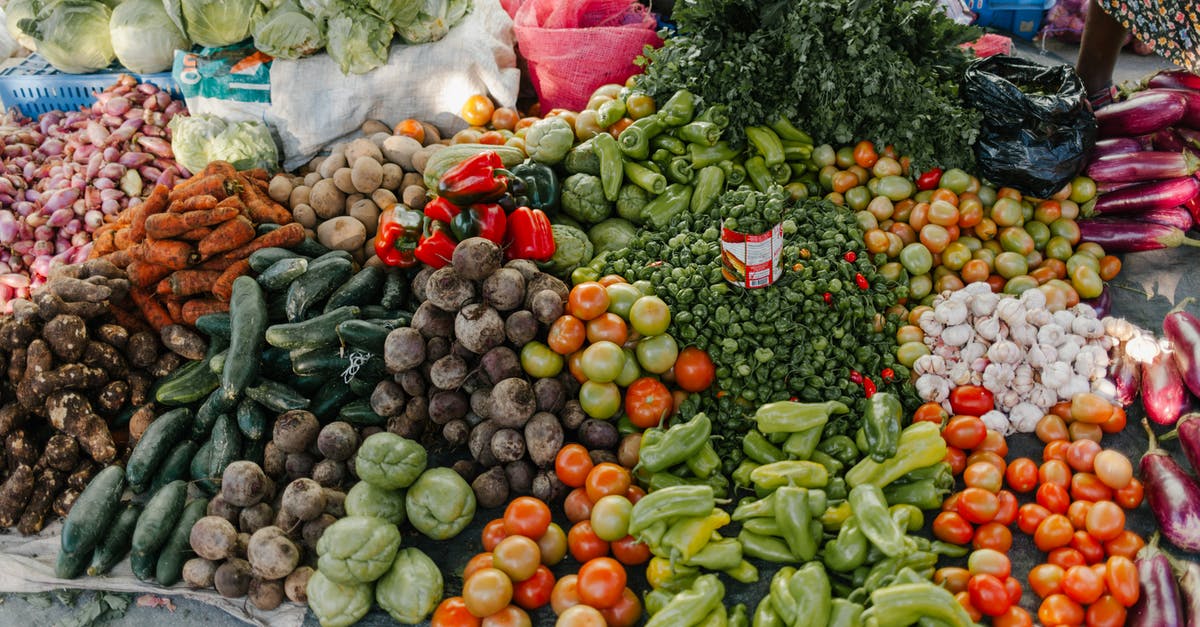 How are strained tomatoes different than tomato sauce? [duplicate] - From above of various vegetables including pepper beets cabbage tomatoes greens potato zucchini and carrot at bazaar