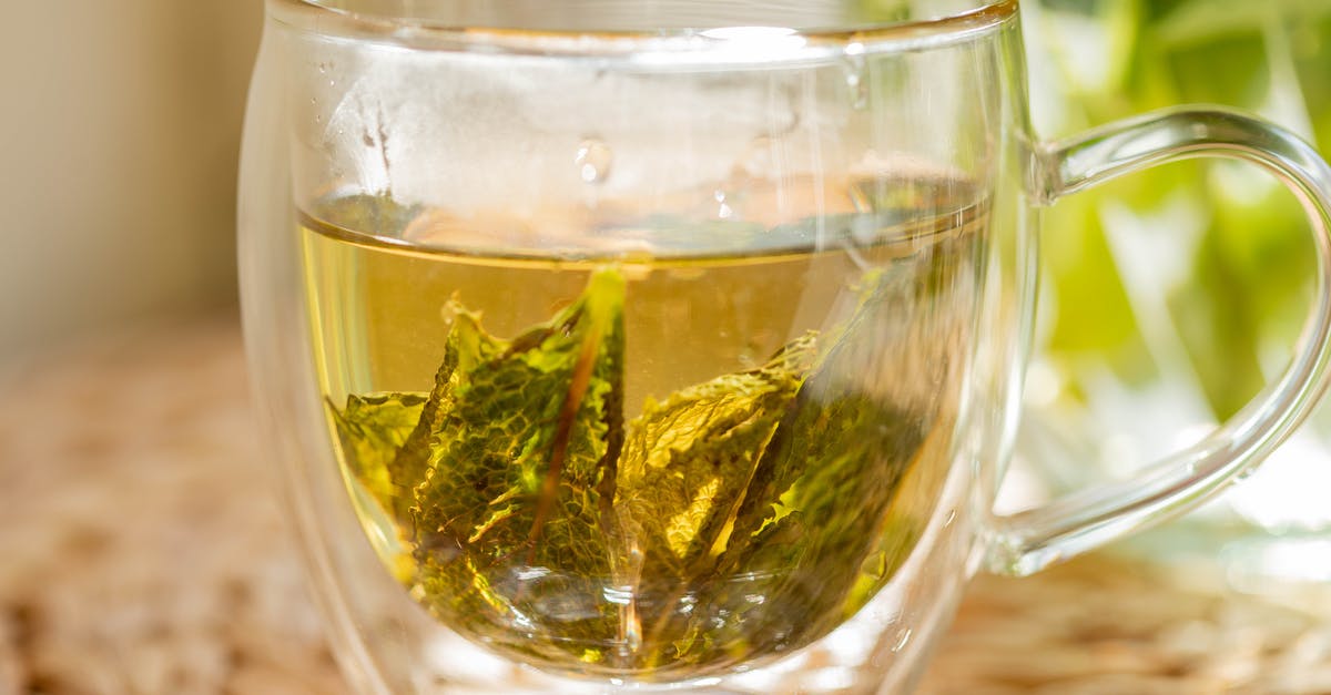 How can I add flavor to green tea at home? - Cup of herbal tea on table How can I add flavor to green tea at home? - Cup of herbal tea on table