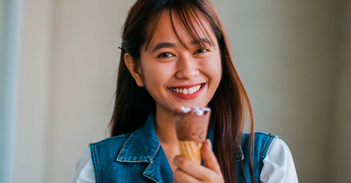 How can I add flavor to meatballs which taste stale from being frozen too long? - Delighted Asian woman with ice cream cone How can I add flavor to meatballs which taste stale from being frozen too long? - Delighted Asian woman with ice cream cone
