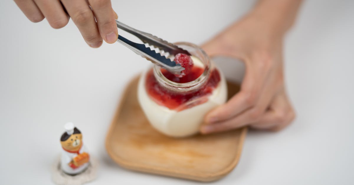 How can I add yogurt to a quickbread recipe? - Crop person decorating yogurt with berries How can I add yogurt to a quickbread recipe? - Crop person decorating yogurt with berries