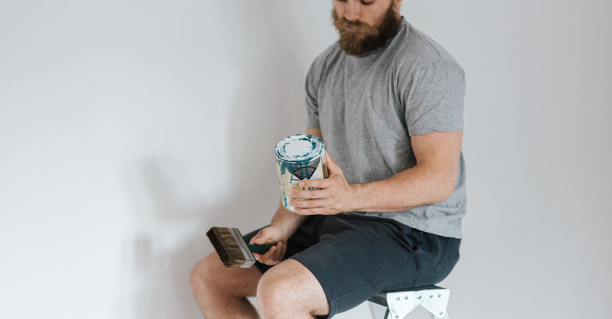 How can I clean chia seeds? - Crop hipster man with can on paint on ladder How can I clean chia seeds? - Crop hipster man with can on paint on ladder