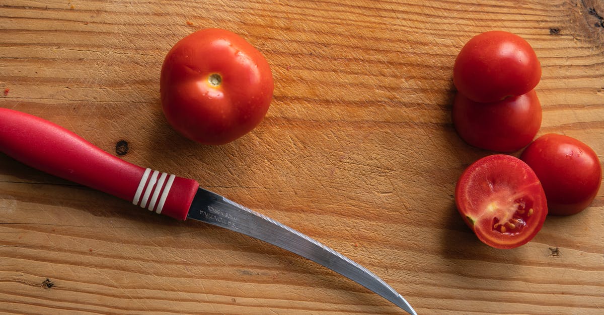How can I clean utensils (e.g., knives) used to cut longkongs? - Knife with fresh tomatoes on wooden board How can I clean utensils (e.g., knives) used to cut longkongs? - Knife with fresh tomatoes on wooden board