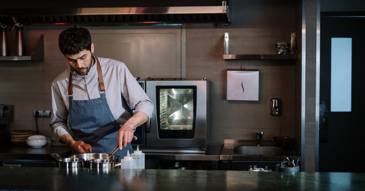 How can I cook a perfect deep-fried Mars bar? - Man in White Dress Shirt Standing Near Black Crt Tv How can I cook a perfect deep-fried Mars bar? - Man in White Dress Shirt Standing Near Black Crt Tv