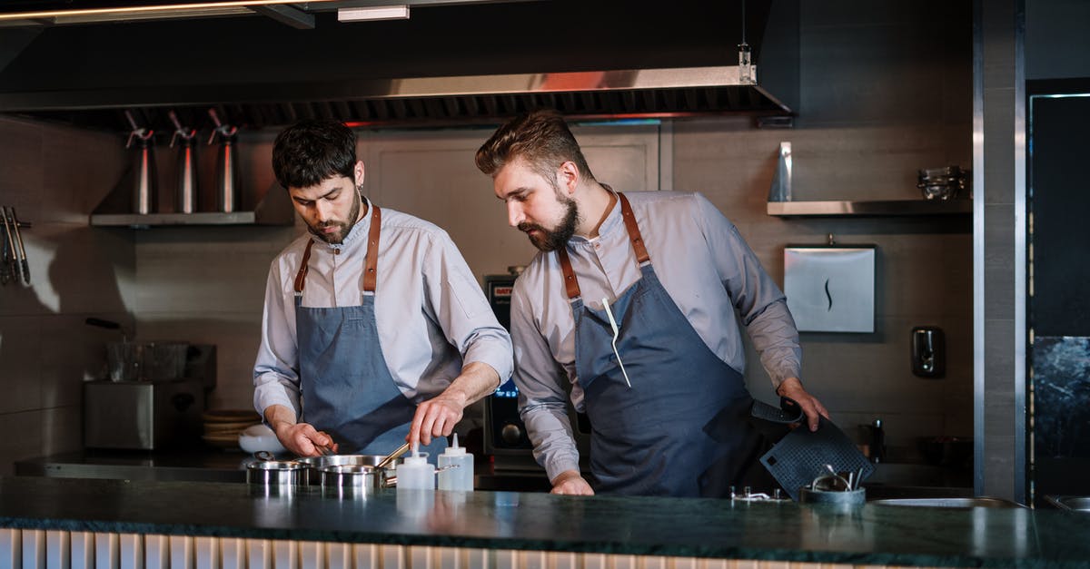 How can I cook a perfect deep-fried Mars bar? - Man in White Dress Shirt Standing Beside Man in Gray Vest How can I cook a perfect deep-fried Mars bar? - Man in White Dress Shirt Standing Beside Man in Gray Vest