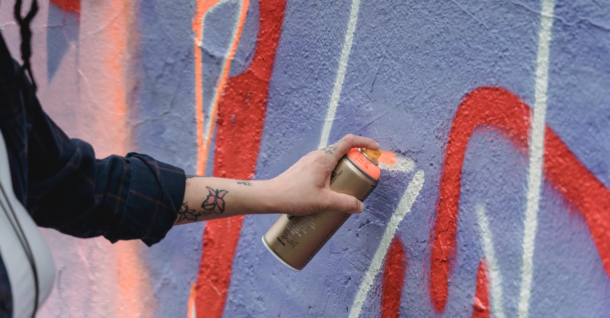 How can I create a chicken substitute? - Crop unrecognizable painter with tattoos in black wear spraying orange paint on colorful purple wall with graffiti on street of city How can I create a chicken substitute? - Crop unrecognizable painter with tattoos in black wear spraying orange paint on colorful purple wall with graffiti on street of city
