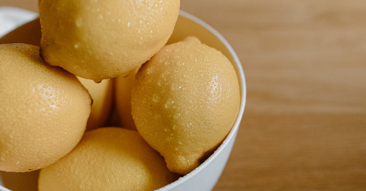 How can I easily peel baby round potatoes? - From above of clean lemons with water drops in bowl on table in kitchen How can I easily peel baby round potatoes? - From above of clean lemons with water drops in bowl on table in kitchen
