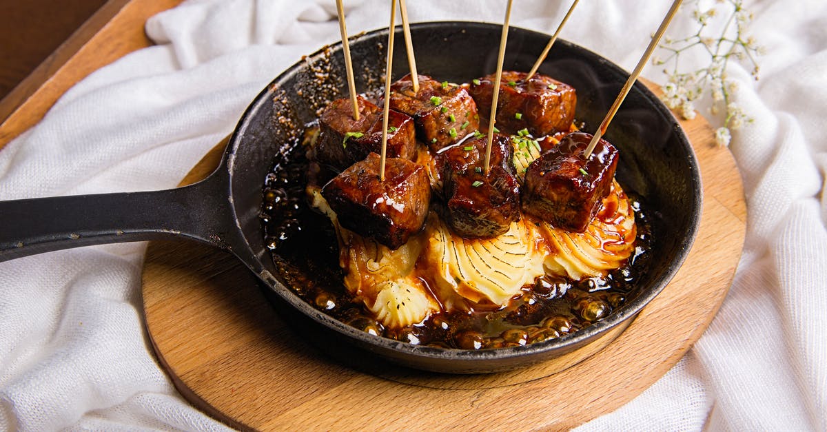How can I evenly grill a thin steak on a skillet? - Close-Up Photo Of Meat Skewers How can I evenly grill a thin steak on a skillet? - Close-Up Photo Of Meat Skewers