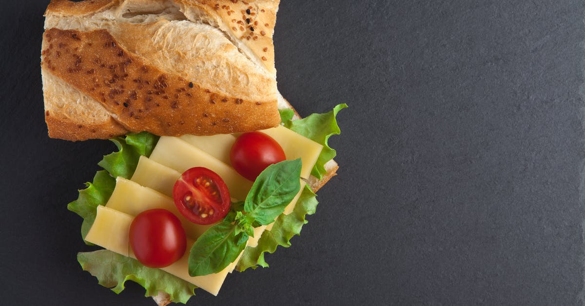 How can I find out how to make clothbound cheddar cheese? - A Bread Near the Cheese with Tomatoes on Top How can I find out how to make clothbound cheddar cheese? - A Bread Near the Cheese with Tomatoes on Top