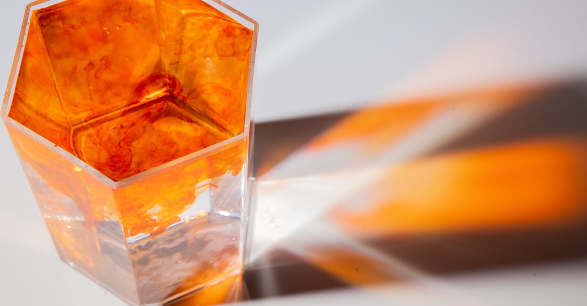 how can I get guar gum to smoothly blend in juice? - Glass with colorful water and paint flows how can I get guar gum to smoothly blend in juice? - Glass with colorful water and paint flows