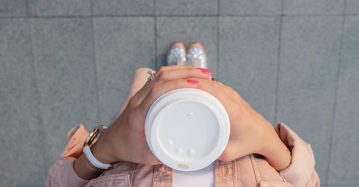 How can I get my Starbucks coffee to taste like the Starbucks store? - Person Holding White Disposable Cup How can I get my Starbucks coffee to taste like the Starbucks store? - Person Holding White Disposable Cup