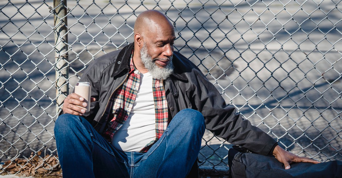 How can I improve sealing of bags for sous vide? - Hairless aged ethnic male in casual outfit touching bag while sitting against mesh fence with beer can How can I improve sealing of bags for sous vide? - Hairless aged ethnic male in casual outfit touching bag while sitting against mesh fence with beer can