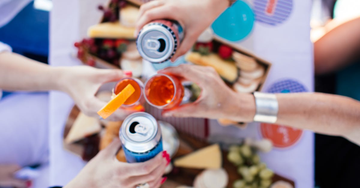 How can I improve the presentation of the food I serve? - Crop people clinking glasses over table How can I improve the presentation of the food I serve? - Crop people clinking glasses over table